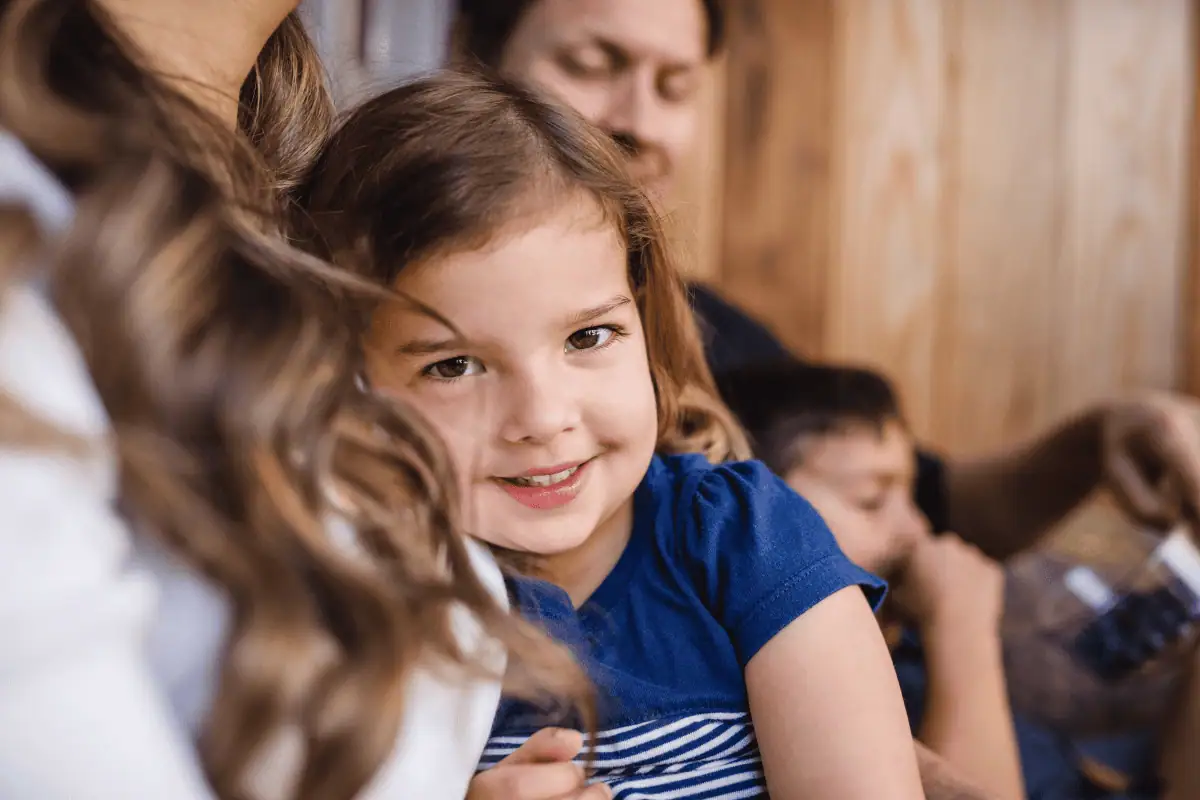 Young girl in church with her family.